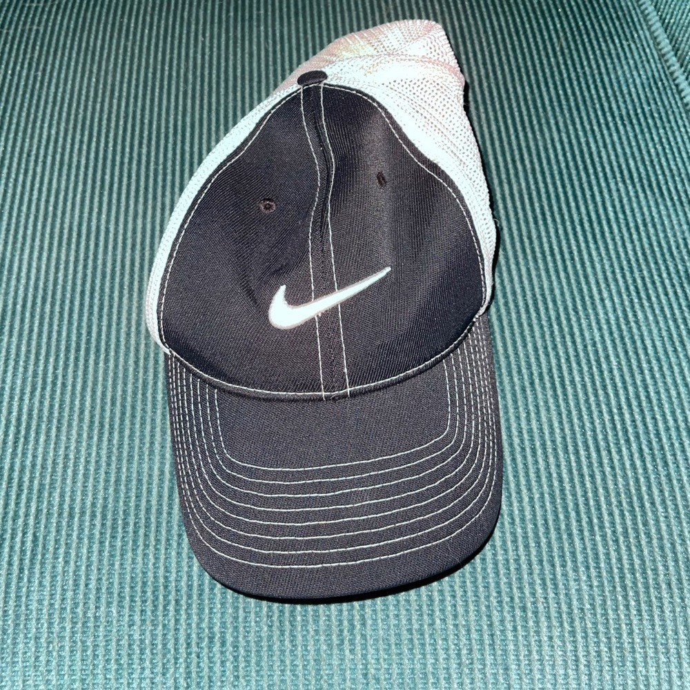 Black and white Nike hat with fish net.